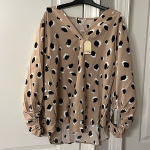 Brand new women’s V neck blouse with bubble sleeves. Taupe/tan with black/white.